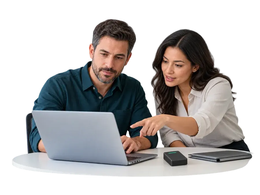 Illustrative security professionals reviewing a customer environment together on a laptop